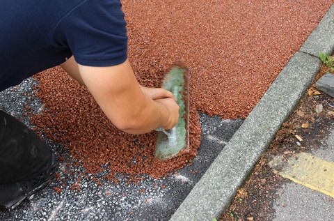 Social Housing Complex Refurbishes Red Walkway